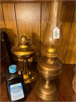 2 brass oil lamps w/ oil- one globe missing