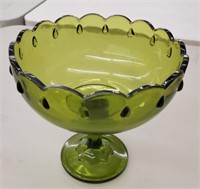 Green glass compote approx 7 inches tall and 7