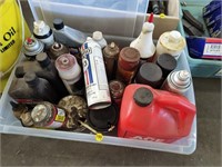 Plastic tote full of sprays, brake fluid,