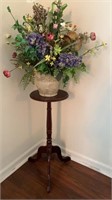Plant stand with floral arrangement