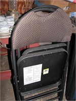 Pair of suchioned seat folding chairs