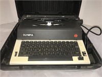 Olympia electric typewriter in hard case.