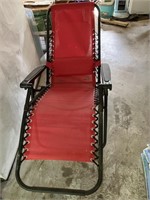 2 red outdoor lounging chairs