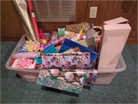 Tote of gift wrap, bows, bags, cards, etc
