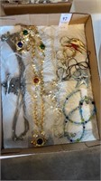 Box of various vintage jewelry