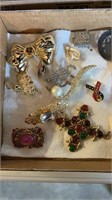 Box of vintage earrings and vintage smaller