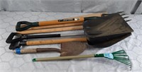 Outdoor tools including shovels, axe handles,
