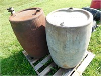 PAIR OF METAL OIL BARRELS