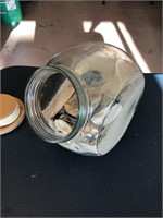 Glass jar of seashells with lid