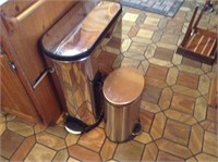 pair of stainless garbage cans
