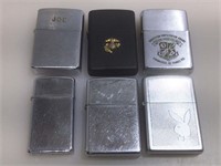 6 Zippo Lighters.