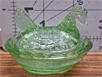 Green glass mini hen on basket