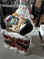 Santa in chimney cookie jar