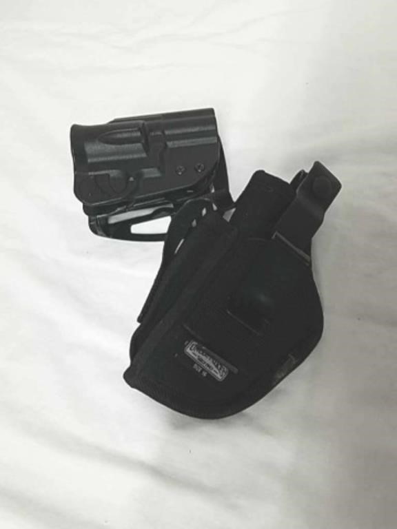 Two gun holsters one is Uncle Mike's size 16