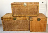 Three Woven Wicker Chests on Wood