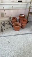 Lot of clay flower pots and 2 plant stands