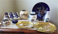 Oriental designs on vases, plates, sake set, trays