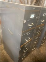 2 grey steel file cabinets