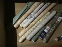 assorted wall paper rolls some unused