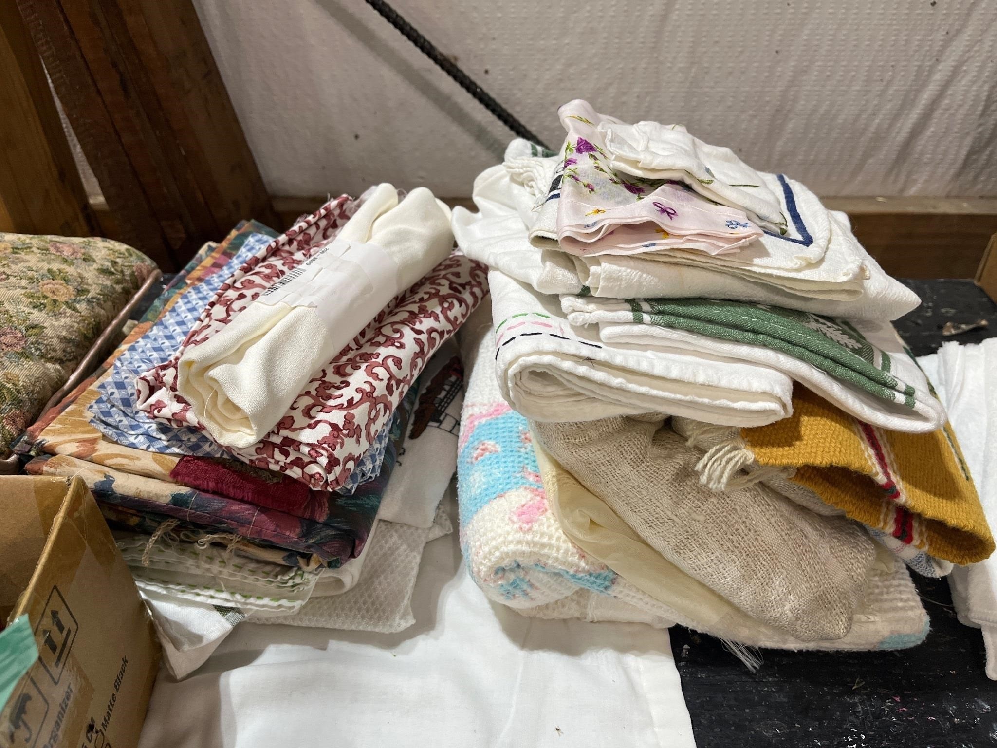 lot of two stacks of misc. fabric and tea towels