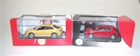 Two J Collection model cars