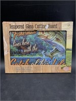 Tempered glass cutting board with fish on it