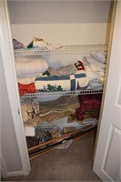 Contents of Closet including patchwork quilt, curt