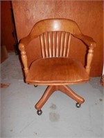 Antique oak swivel chair on rollers