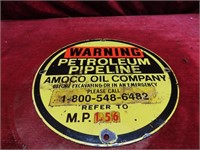 Porcelain Amoco pipeline marker sign.