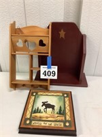 Wooden shelves and moose picture