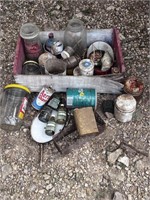 Vintage wood crate with old tins, bottles, boxes