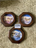Three wall hanging Christmas/winter plates with
