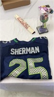 Sherman jersey, wine glass, Dalmatians poster