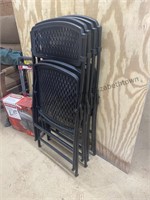 Set a four metal and plastic folding chairs,