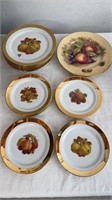 14 gold rimmed fruit plates, decorated with