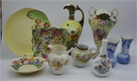 Ten floral decorated ceramic jugs, vases & others