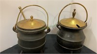 Lot of two cast-iron and brass fire starter pots.