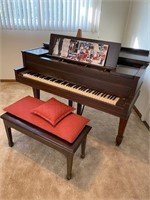 Emerson baby grand piano**.