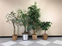 A collection of large artificial plants.