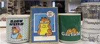 Two Garfield Mugs And 50 Book Plates