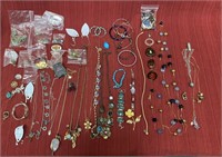 48 costume jewelry pieces. 13 necklaces, 12