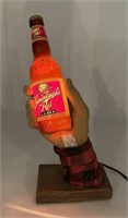 Leinenkugel’s Red Lager hand holding bottle
