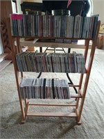 CD rack with lots of CDs 39 x 6.5 x 22