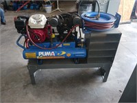 Puma gas-powered air compressor on stand