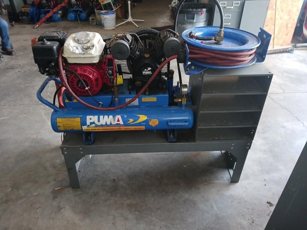 Puma gas-powered air compressor on stand