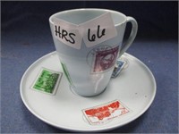 Stamp teacup and saucer, repaired .
