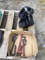 D1. (2) welding helmets with pipe wrenches