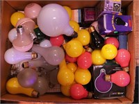 Two boxes of light bulbs, many colors, some