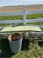 tin folding table and trash can