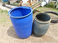 Two Plastic Barrels by Front Door - Can be driven
